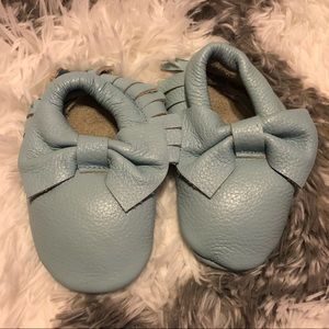 Light blue bow moccasins